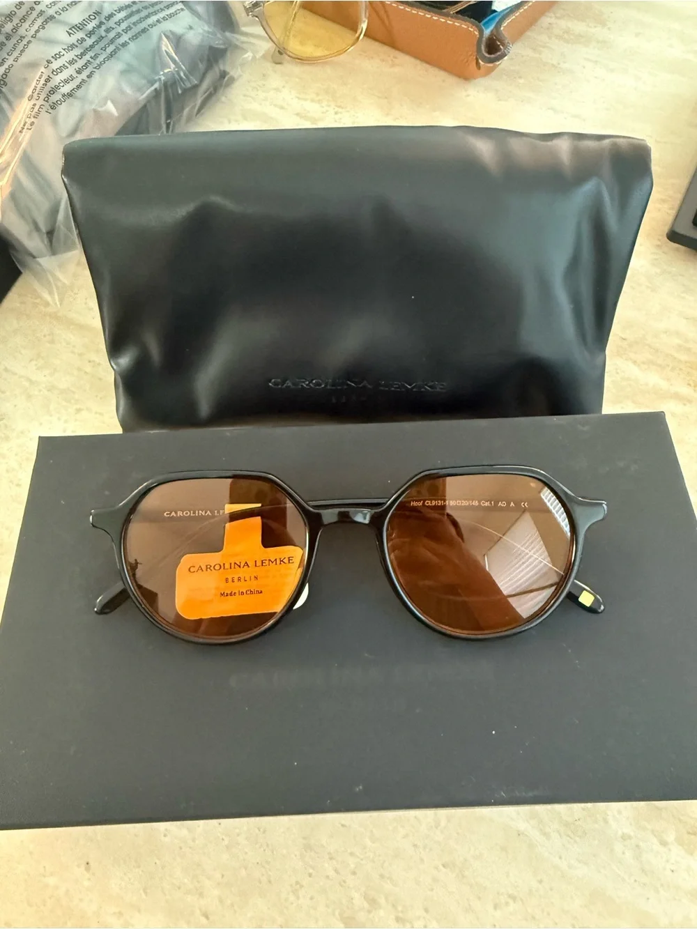 Carolina Lemke Men’s Black Frame Orange Lens Sunglasses